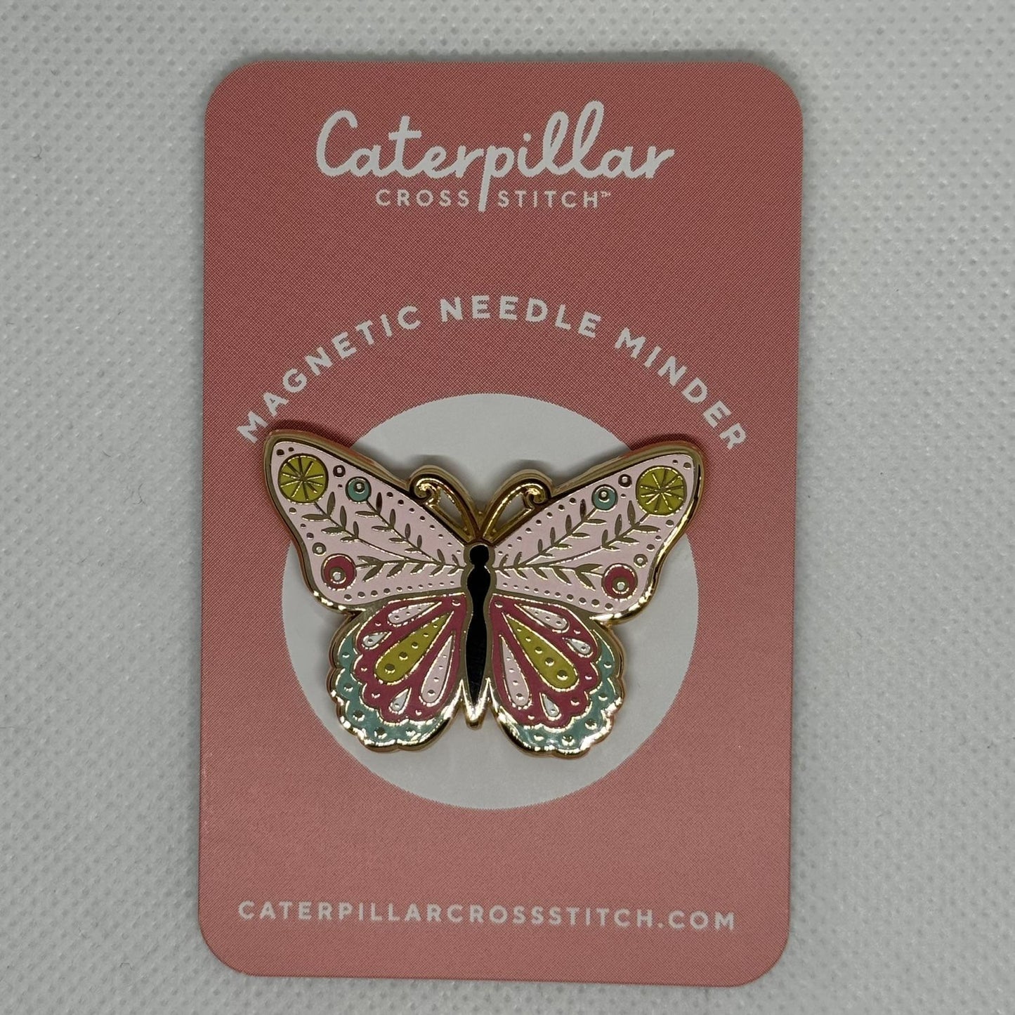 Butterfly needle minder