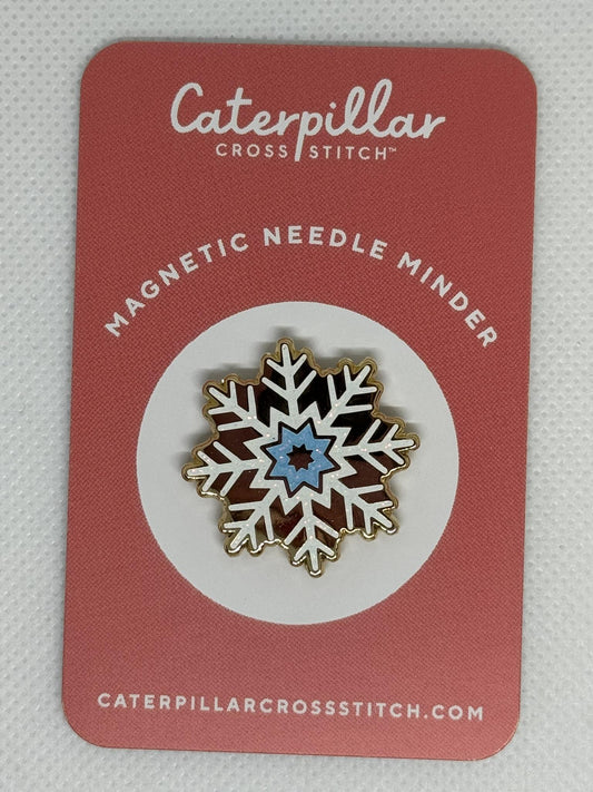 Snowflake needle minder