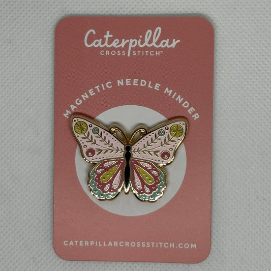 Butterfly needle minder