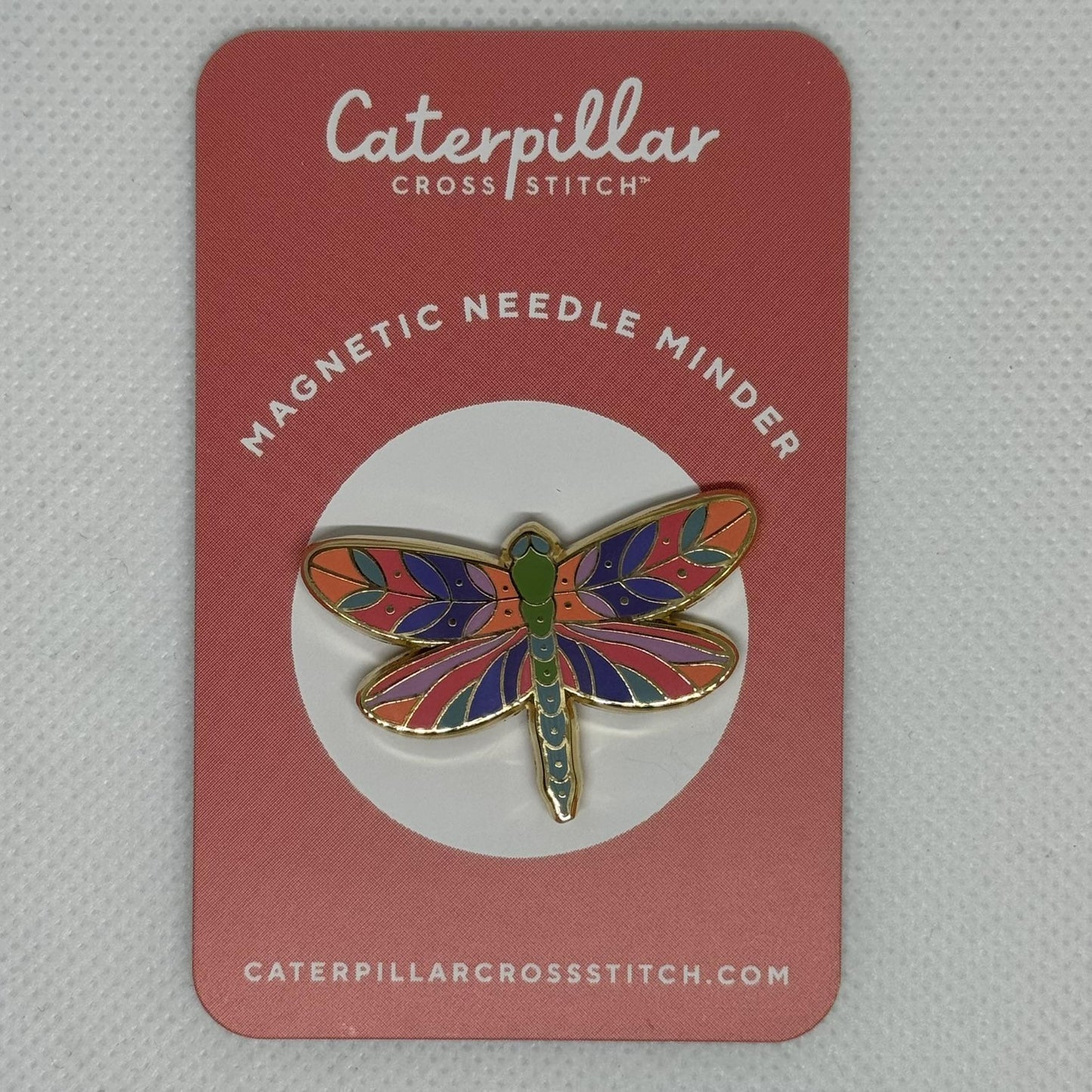 Dragonfly needle minder