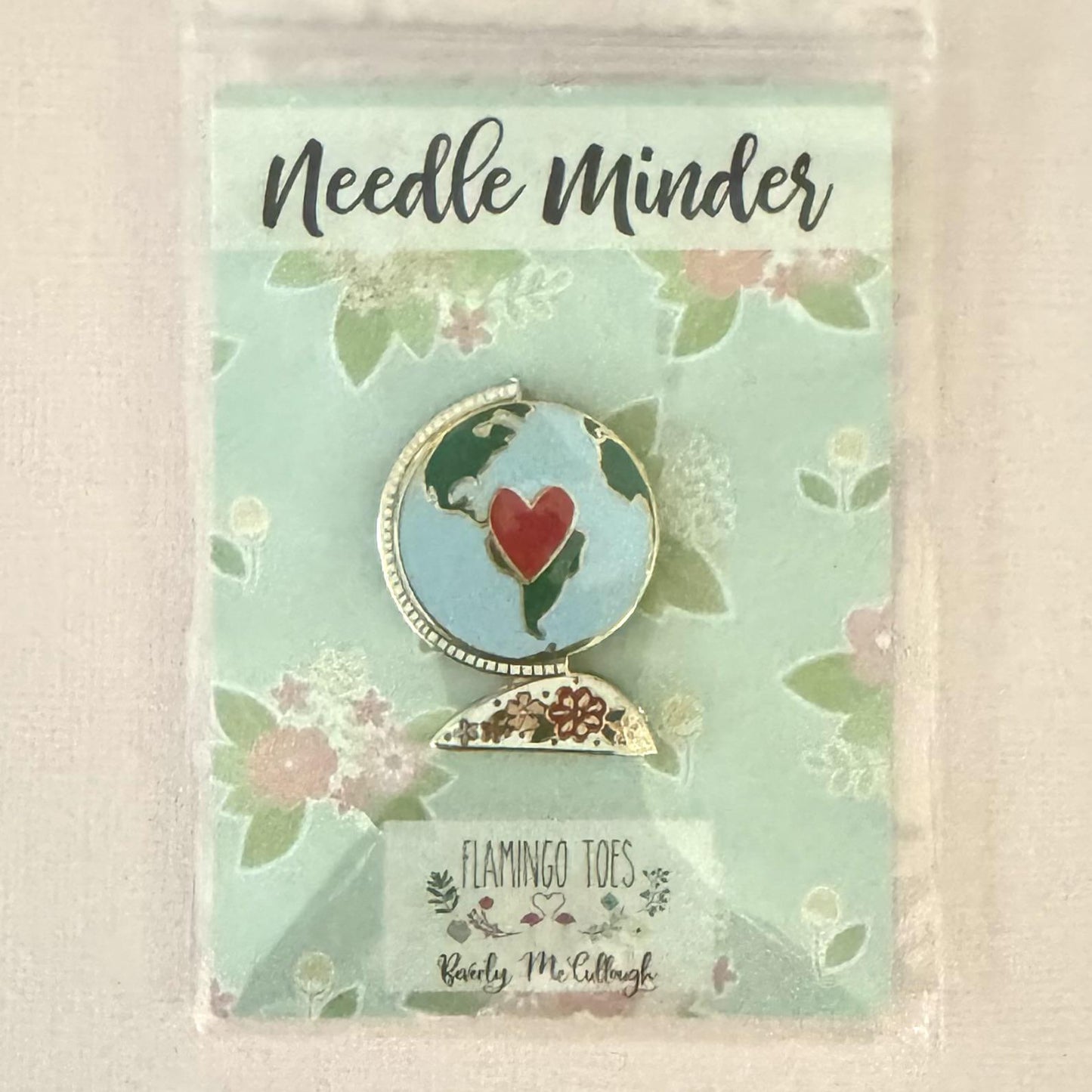 Vintage Globe needle minder