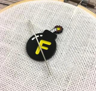 F-Bomb needle minder